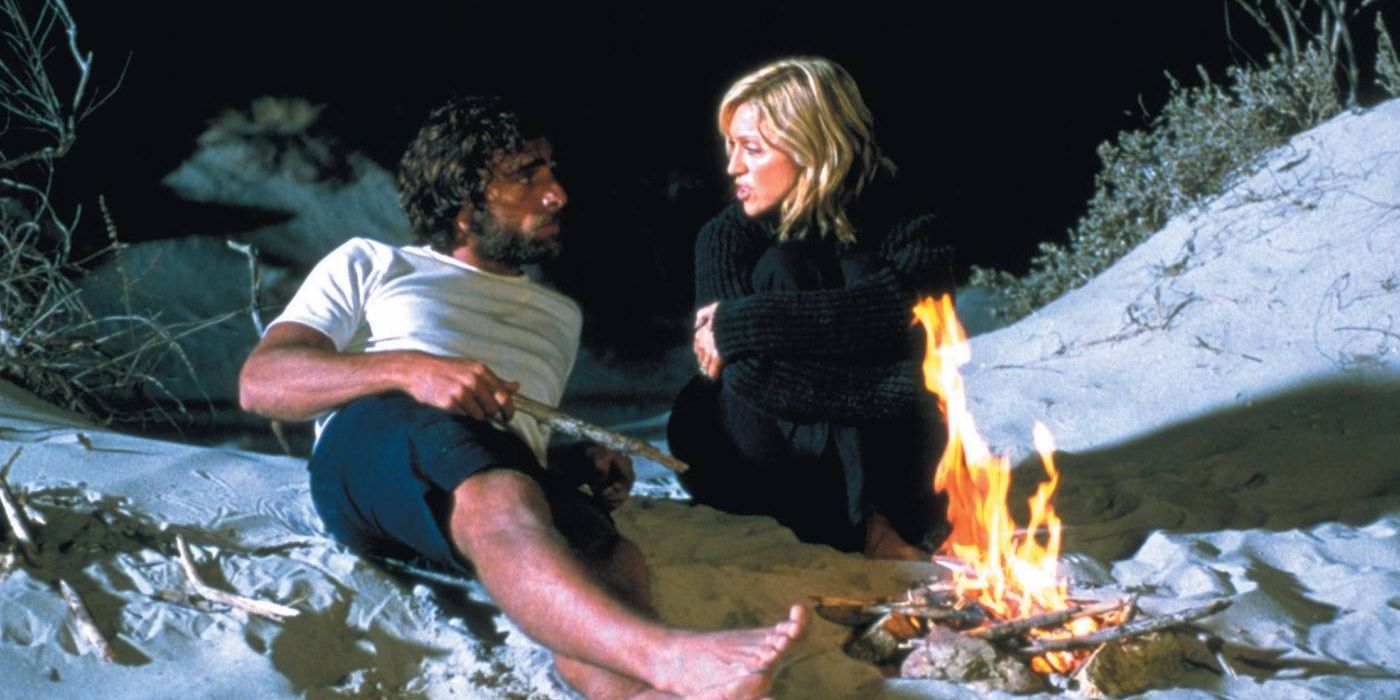 Madonna talking to Adriano Gianni on the beach in Swept Away at Night
