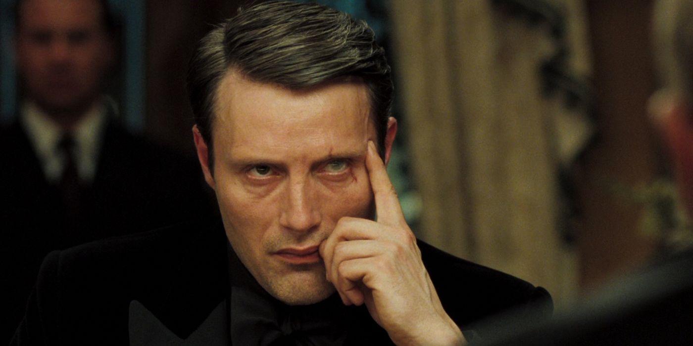 Mads Mikkelsen as Le Chiffre Putting a Finger to His Temple in Casino Royale
