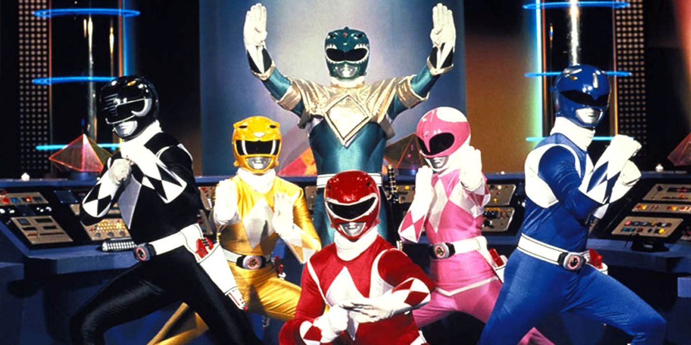Black Ranger, Yellow Ranger, Green Ranger, Red Ranger, Pink Ranger, and Blue Ranger in front of the Green Ranger in the Command center in Mighty Morphin Power Rangers