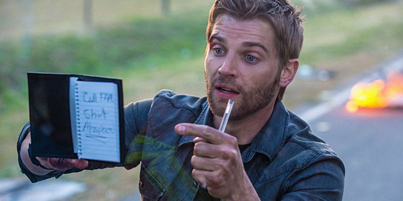 Mike Vogel as Dale "Barbie" Barbara holding up a note to the dome in Under the Dome