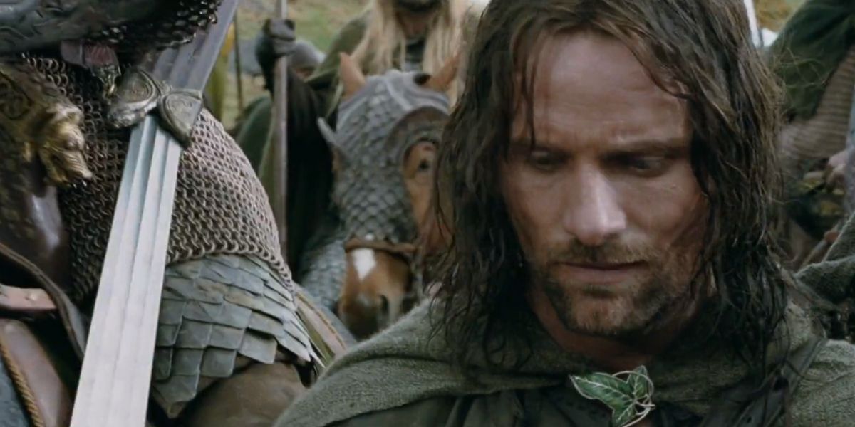 Aragorn looking down somberly among the horsemen of Rohan in The Lord of the Rings.