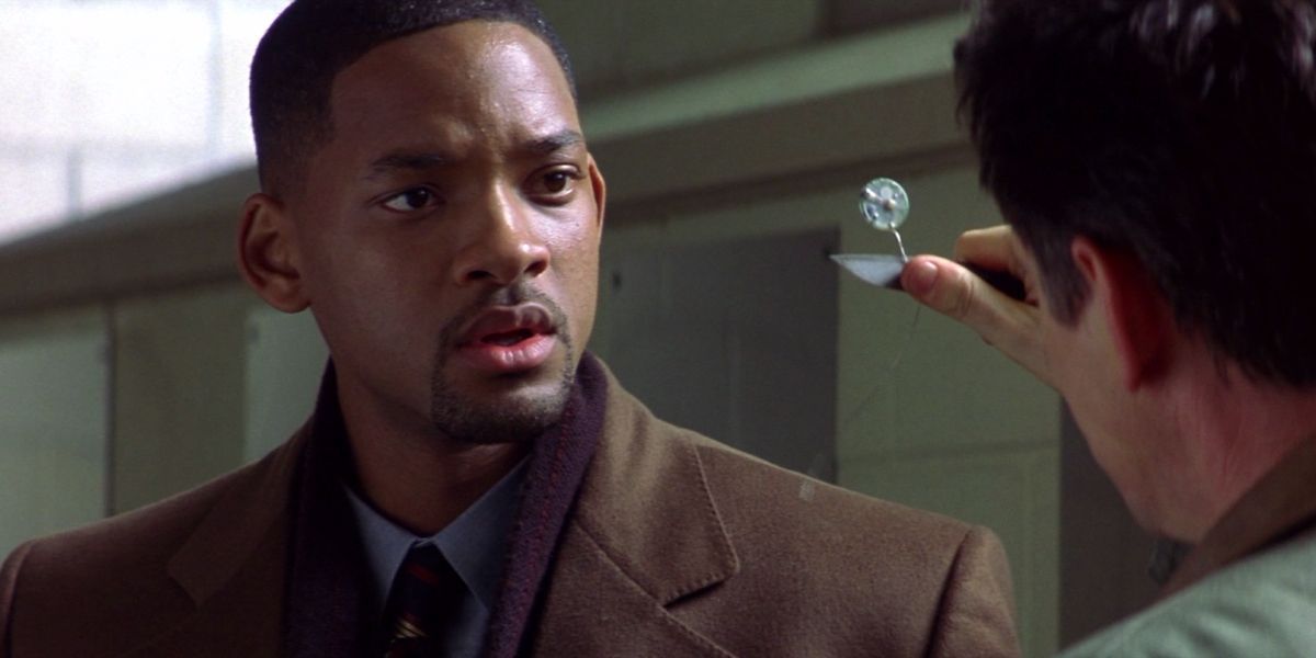 Will Smith being shown bugging device