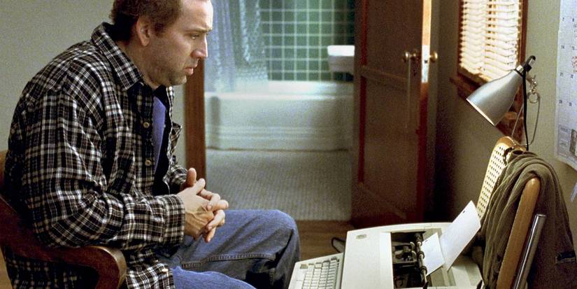 Nicolas Cage sits at a typewriter in Adaptation