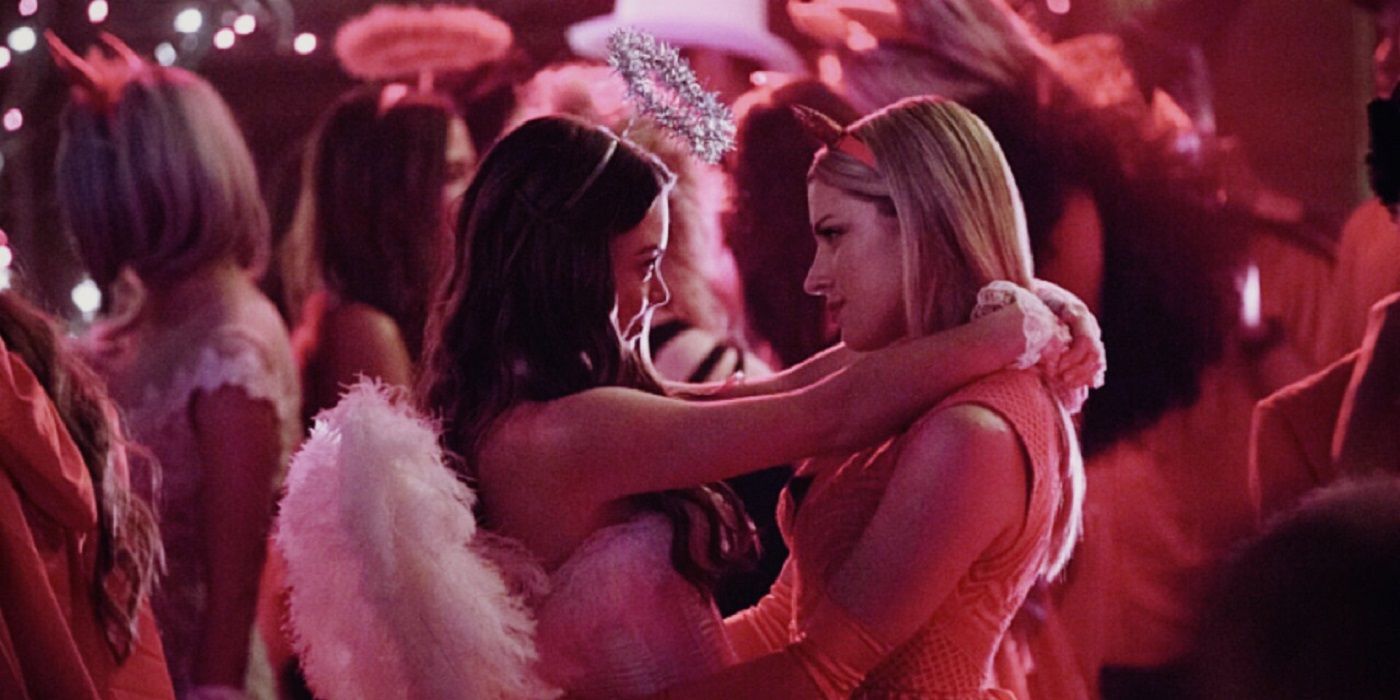 Nora and Mary Louse dance in angel and devil outfits on The Vampire Diaries
