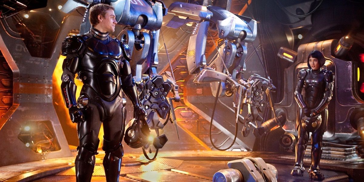 (L-r) CHARLIE HUNNAM as Raleigh Beckett and RINKO KIKUCHI as Mako Mori in Warner Bros. Pictures’ and Legendary Pictures’ sci-fi action adventure “Pacific Rim,” a Warner Bros. Pictures release.