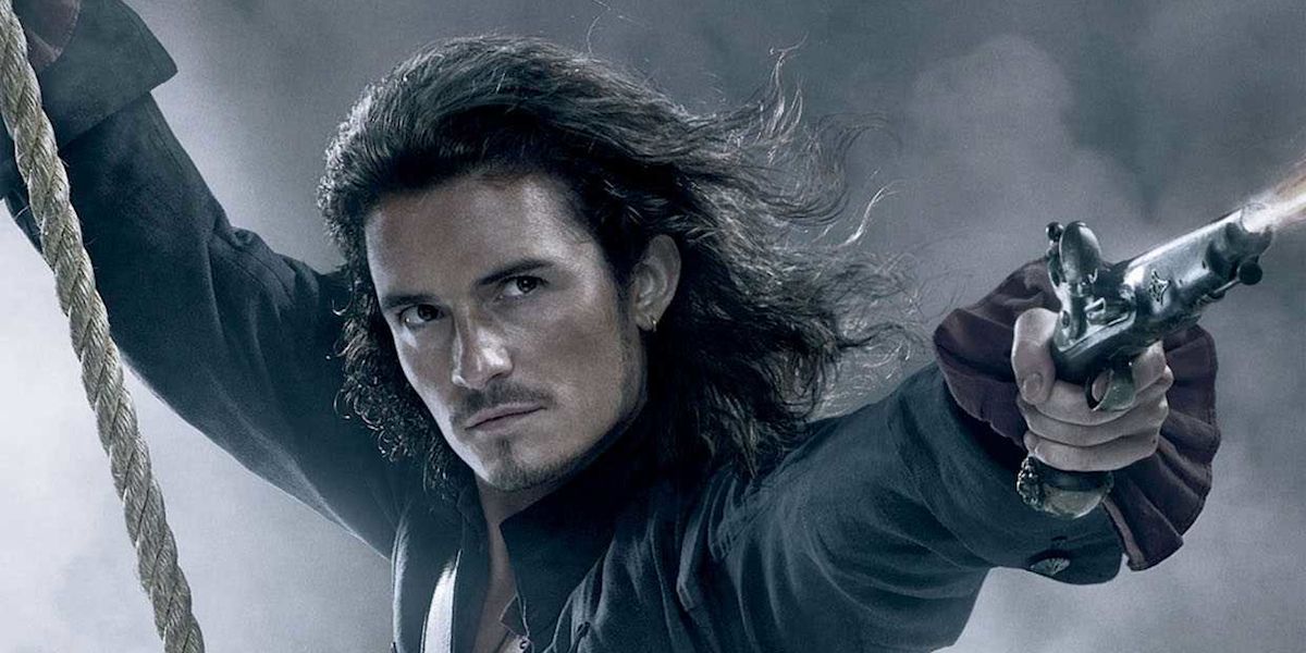 Pirates of the Caribbean Dead Men Tell No Tales' Orlando Bloom swinging from rope, pointing a gun