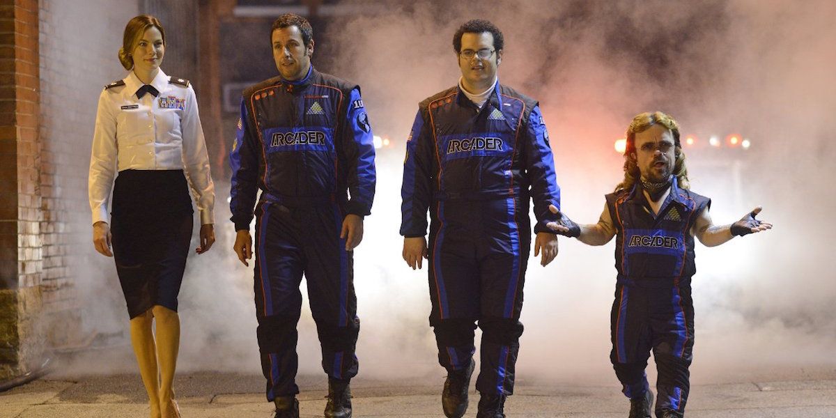 The team walks out from smoke in Pixels Monaghan, Adam Sandler, Josh Gad, and Peter Dinklage in 'Pixels'