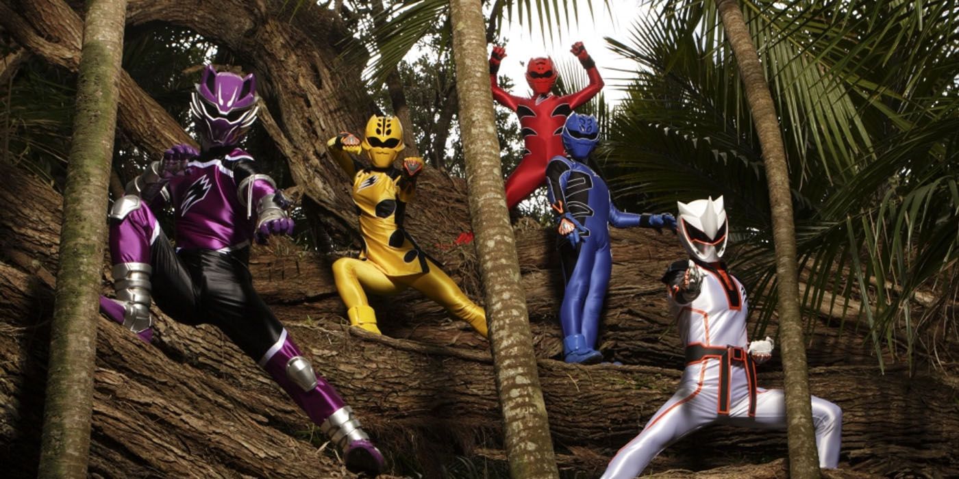 The Power Rangers Jungle Fury team in uniform amongst the trees