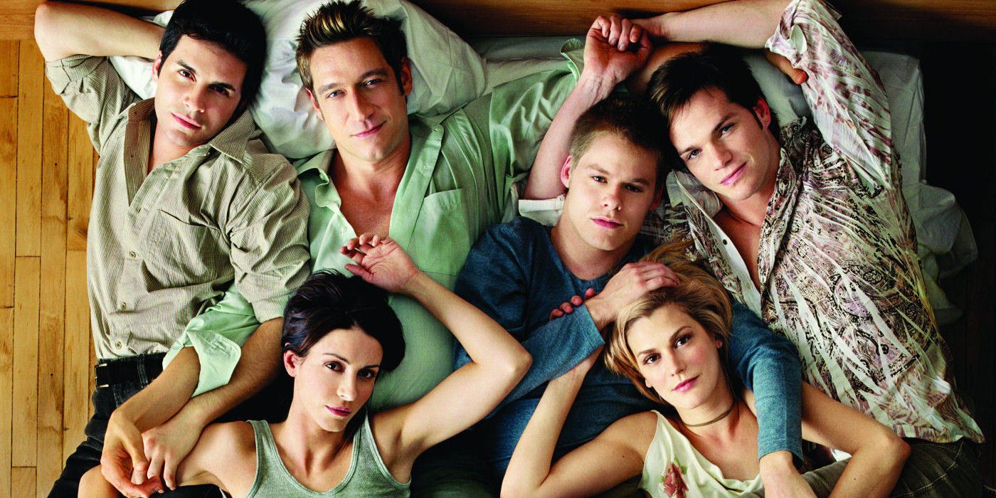 Characters lying in bed together in Queer as Folk