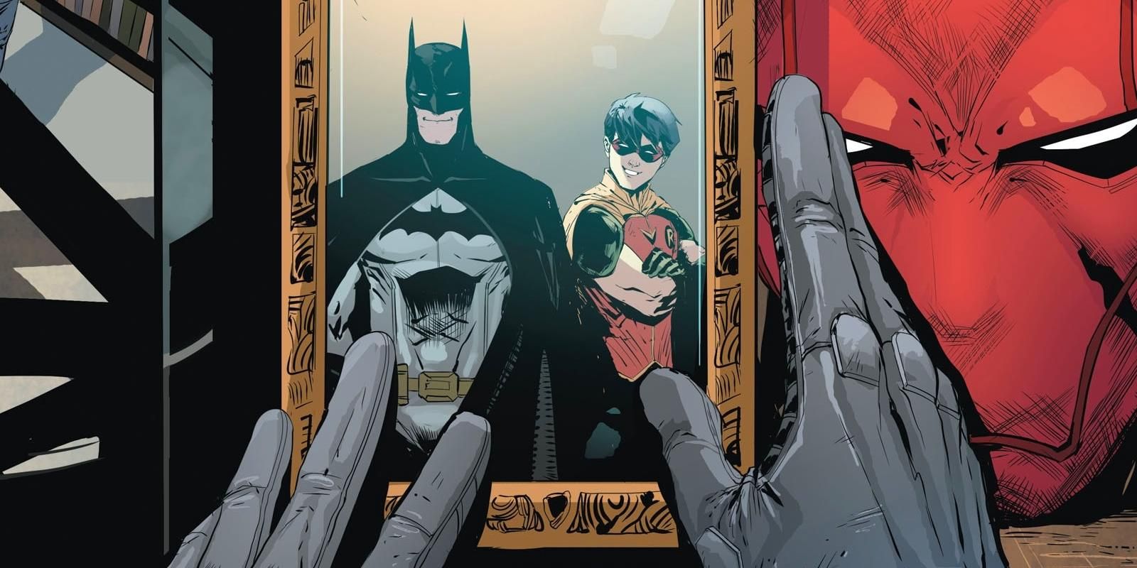 Red Hood looks at a picture of himself as Robin and Batman in DC Comics.