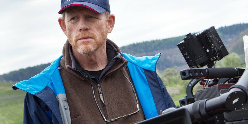 Director Ron Howard looking serious next to a camera.