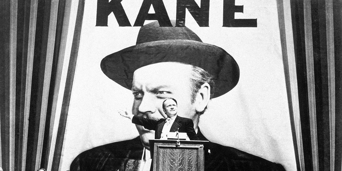 Kane at a podium delivering a speech in Citizen Kane