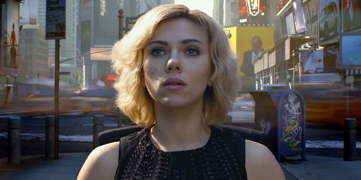 Scarlett Johansson in Lucy with Time's Square behind her