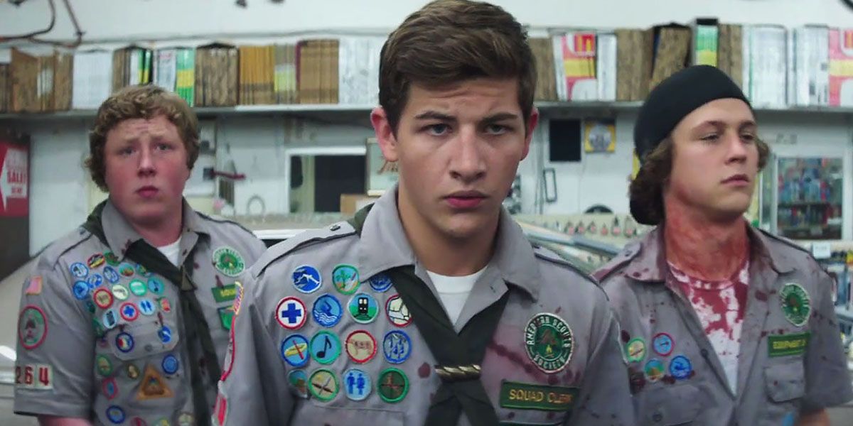 Ben, Carter, and Augie in the Scout uniforms, walking in Scout's Guide to the Zombie Apocalypse