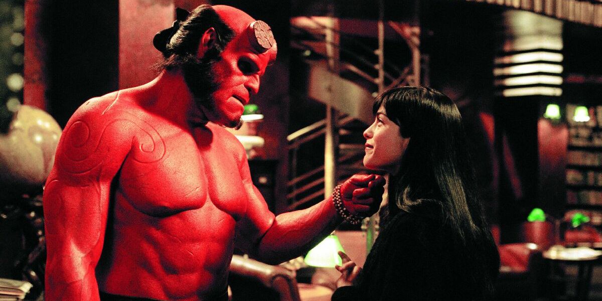Selma Blair and Ron Perlman as Hellboy