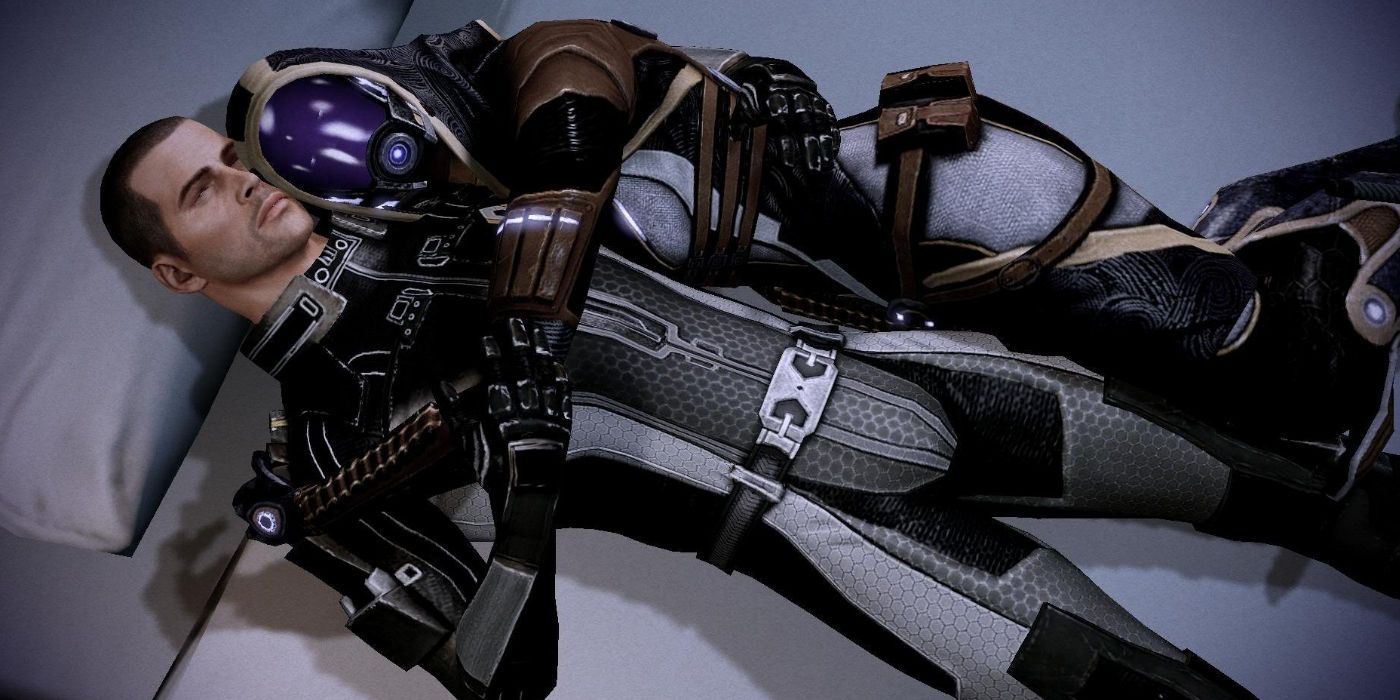 Shepard and Tali in Mass Effect 2 lying on a bed cuddling