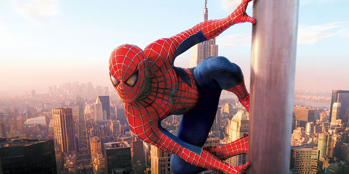Spider-Man clings to a flag in poster for Spider-Man (2002)