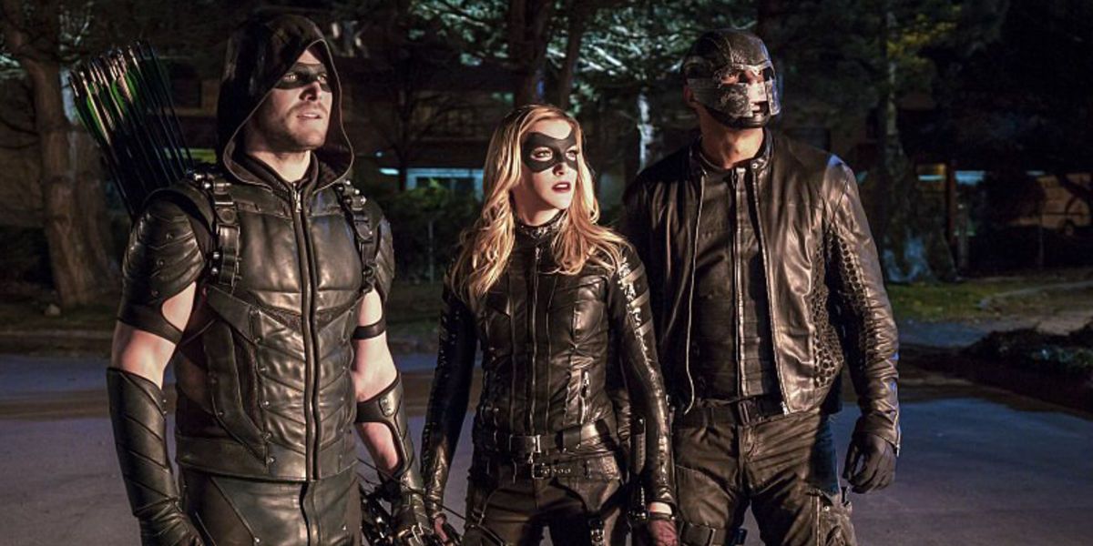 Stephen Amell Katie Cassidy and David Ramsey in Arrow Season 4 Episode 12