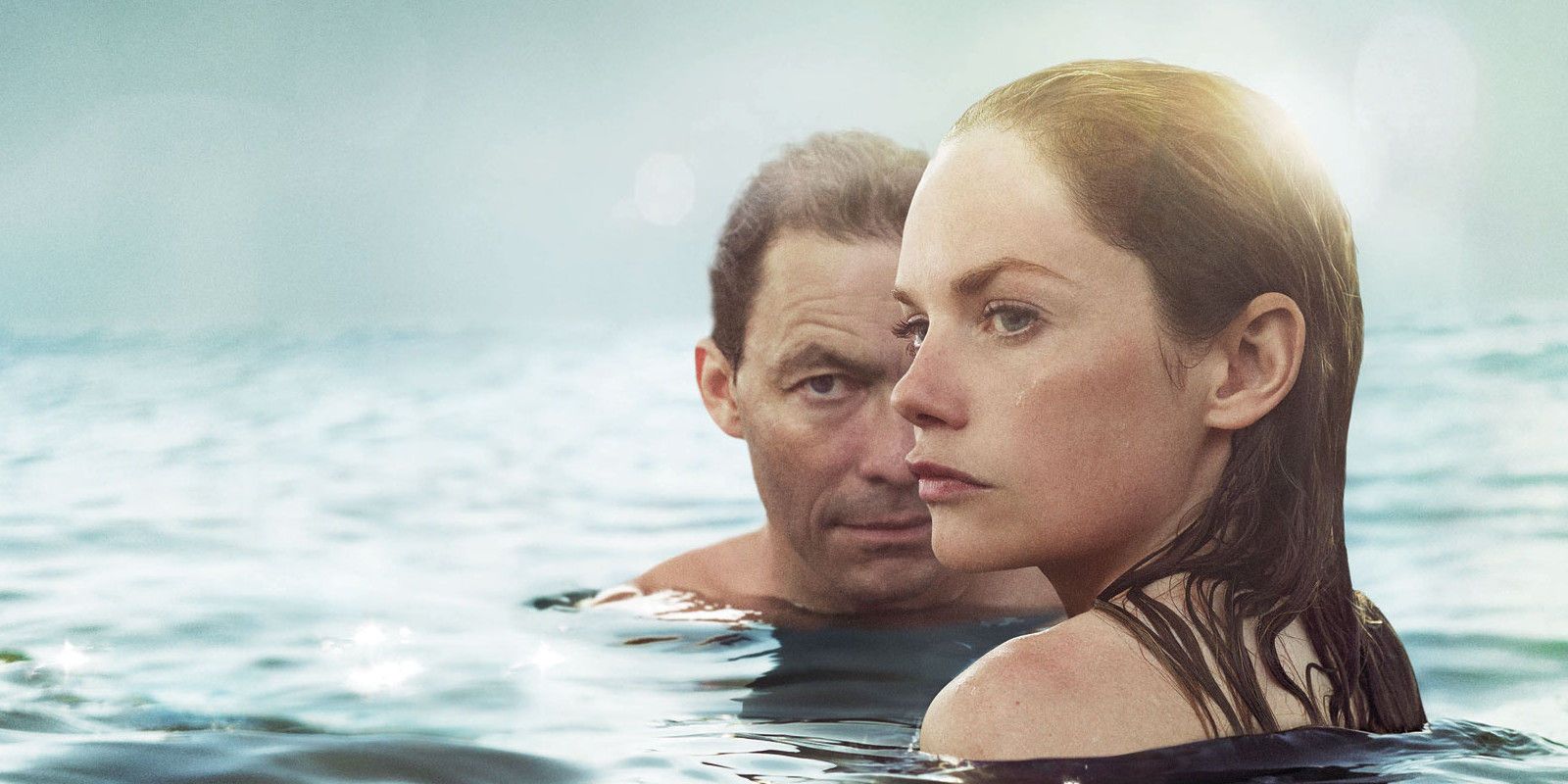 Noah Solloway (Dominic West) and Alison Bailey (Ruth Wilson) in the ocean together in a post for The Affair