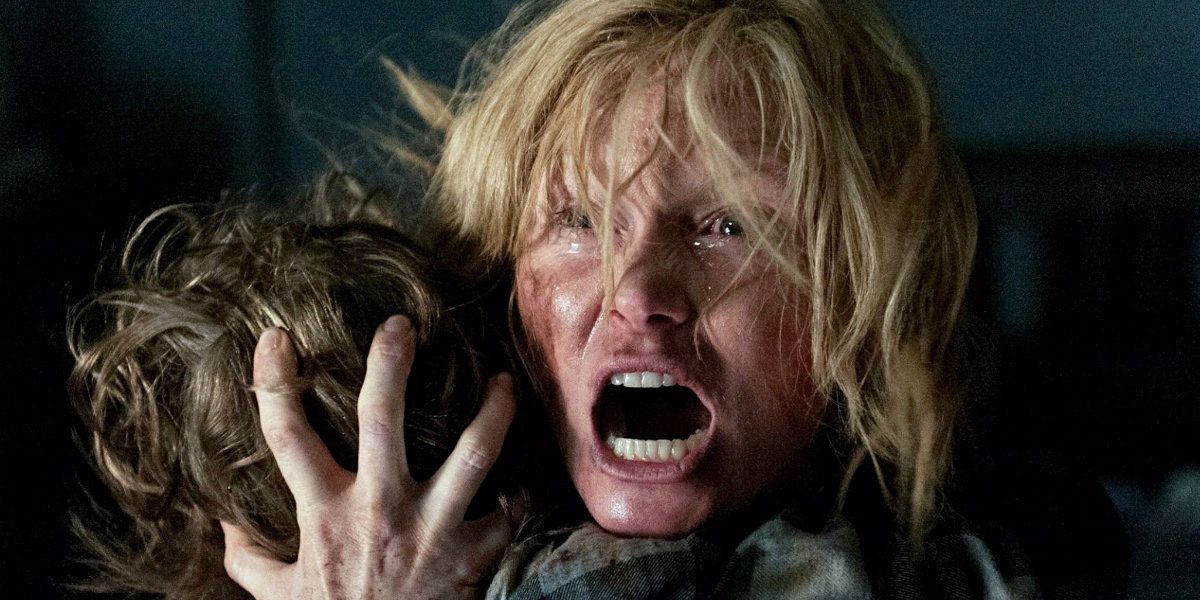 A woman screaming while holding a boy in 'The Babadook'