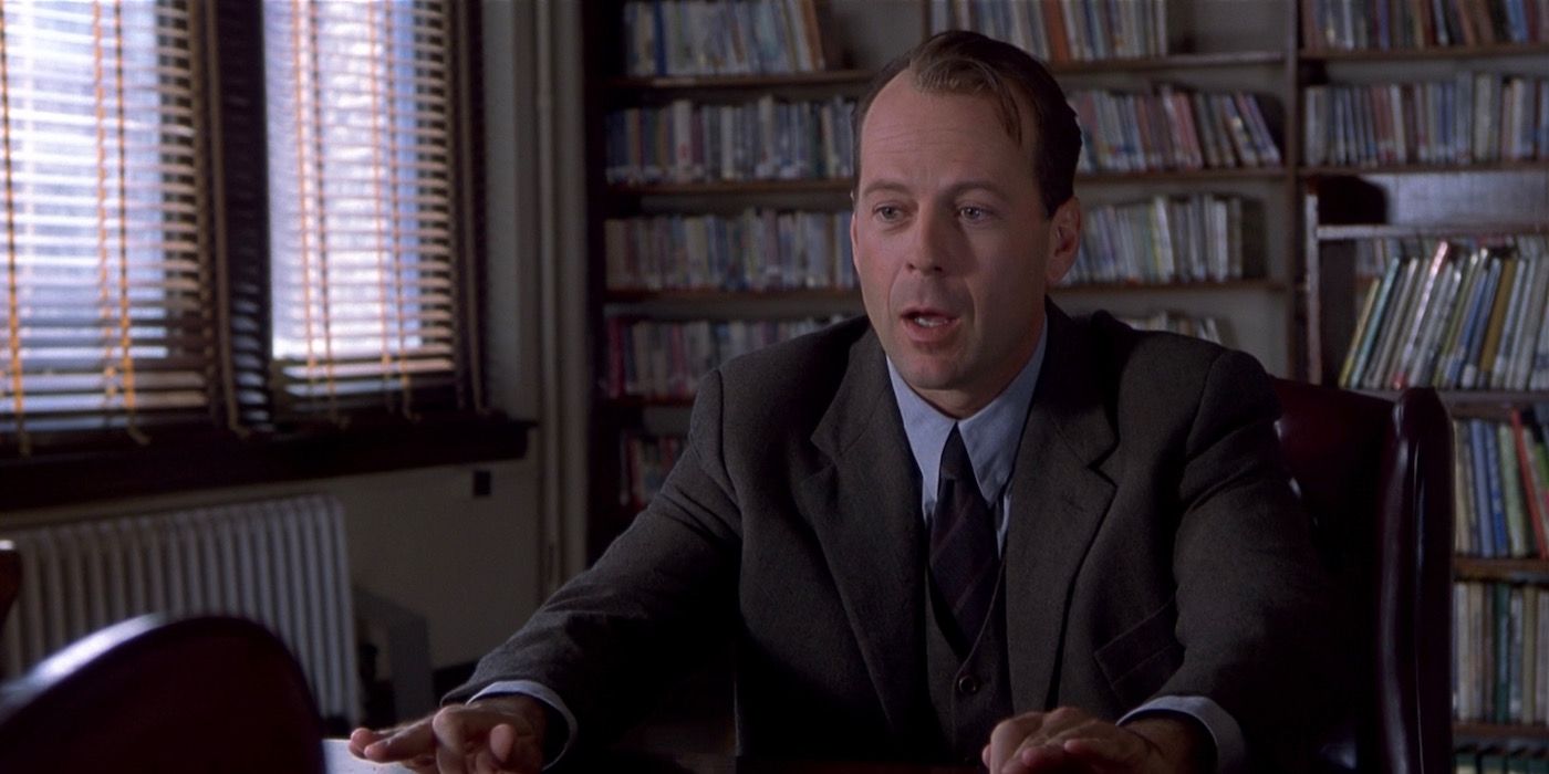 Malcolm Crowe sitting behind a desk in The Sixth Sense