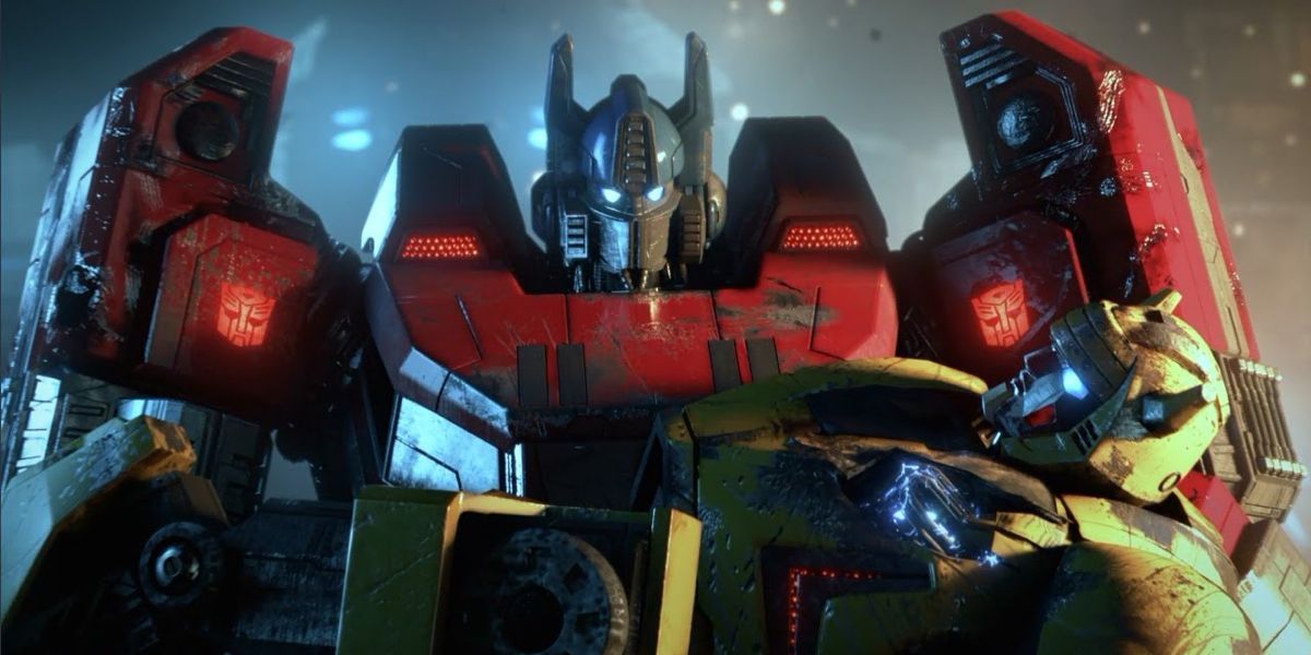 A robot carries another fallen robot in Transformers Fall of Cybertron