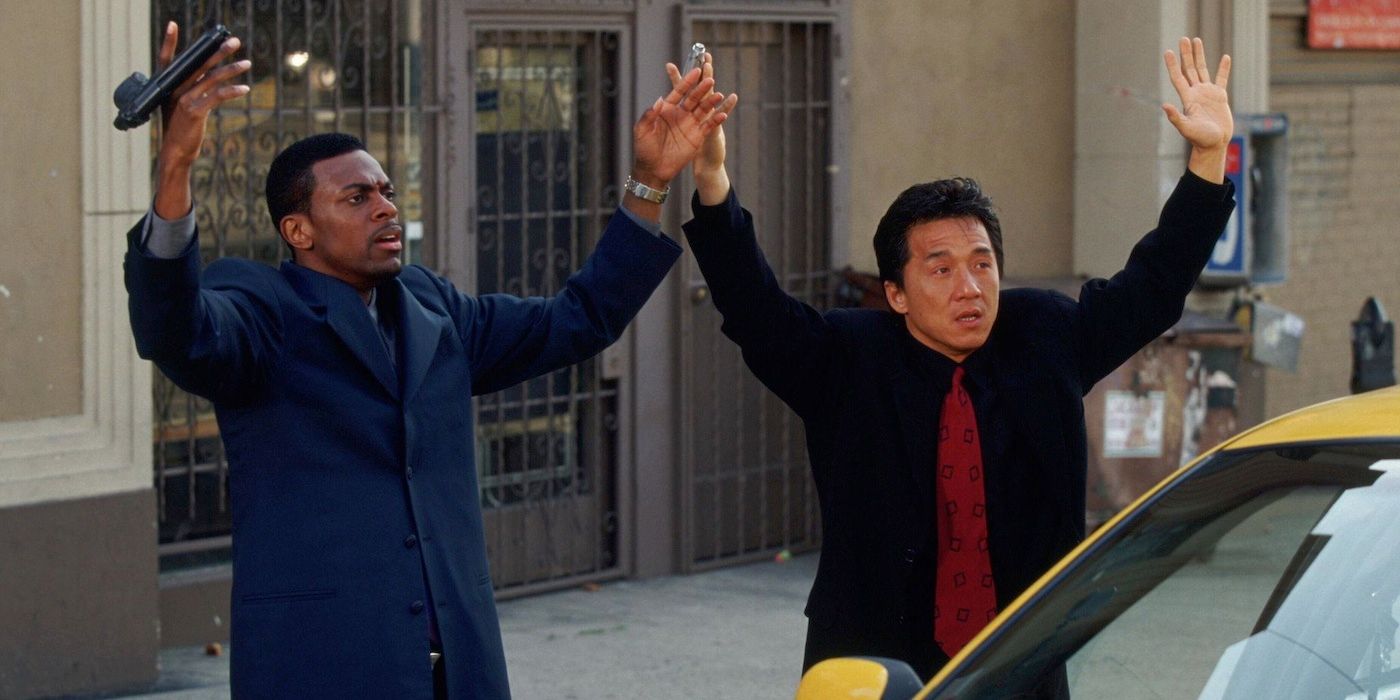 Chris Tucker & Jackie Chan holding up their hands in Rush Hour