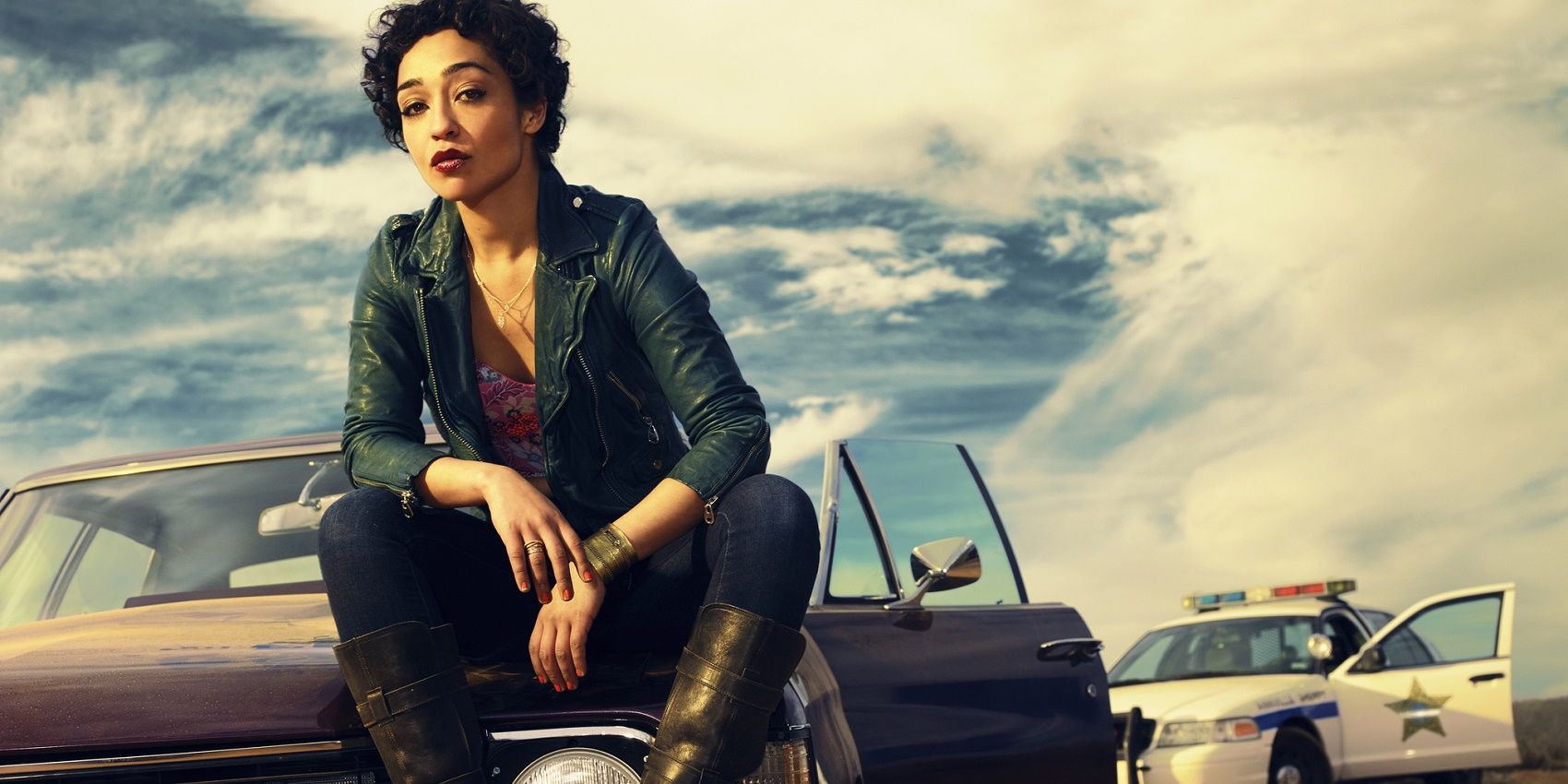 Tulip sits on the hood of a car in a Preacher promo image