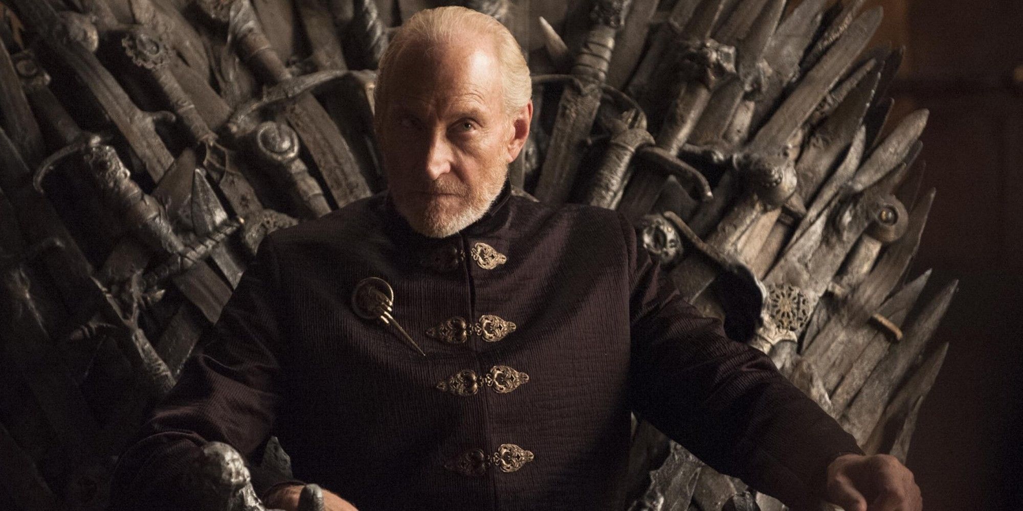 Tywin Lannister sitting on the Iron Throne in Game of Thrones.