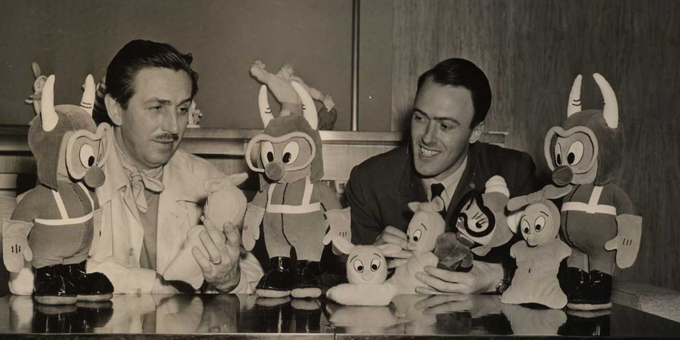 Walt Disney and Roald Dahl sitting with Gremlins