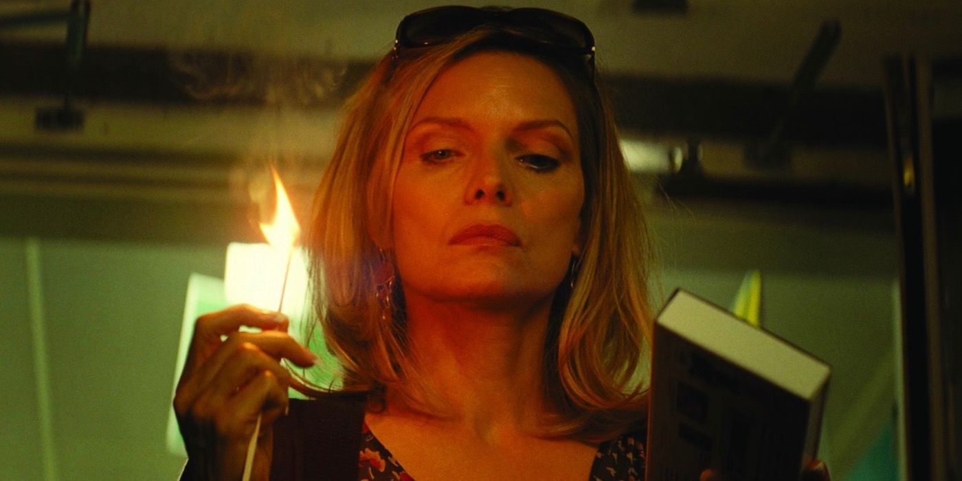 Michelle Pfeiffer holding a burning match in What Lies Beneath.