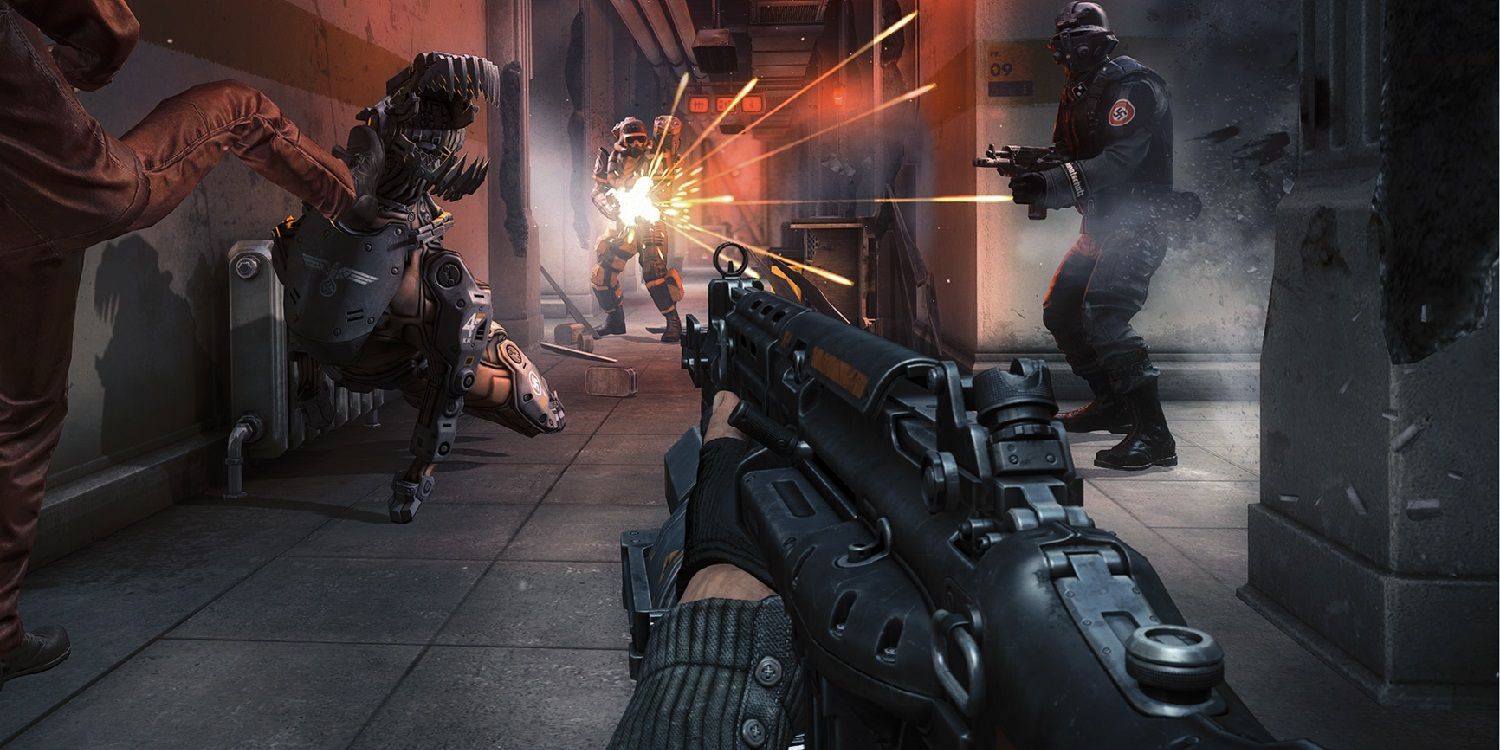 An image of a gun pointing at Nazis and a robotic enemy in the video game Wolfenstein The New Order