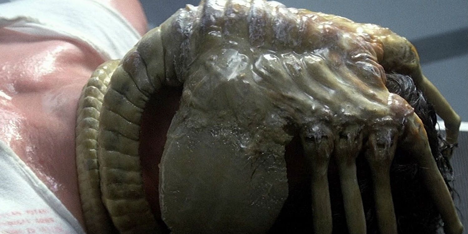 Facehugger from Alien clinging on victims face.