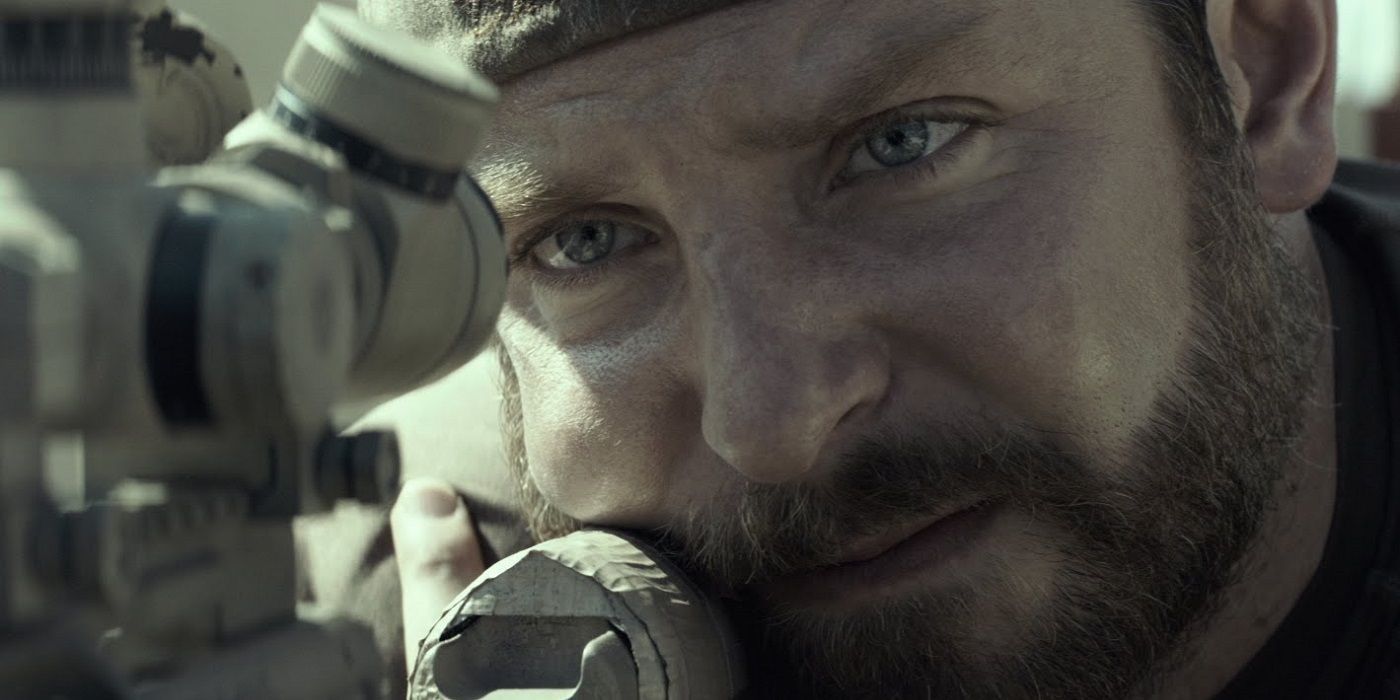 Chris Kyle looking troubled while pointing his gun in American Sniper