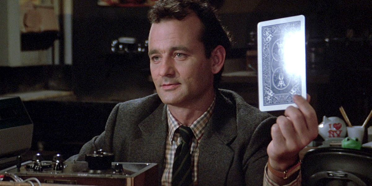 Bill Murray holding a tarot card in Ghostbusters