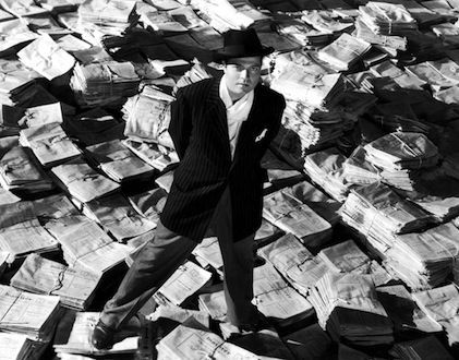 Citizen Kane on stacks of newspaper