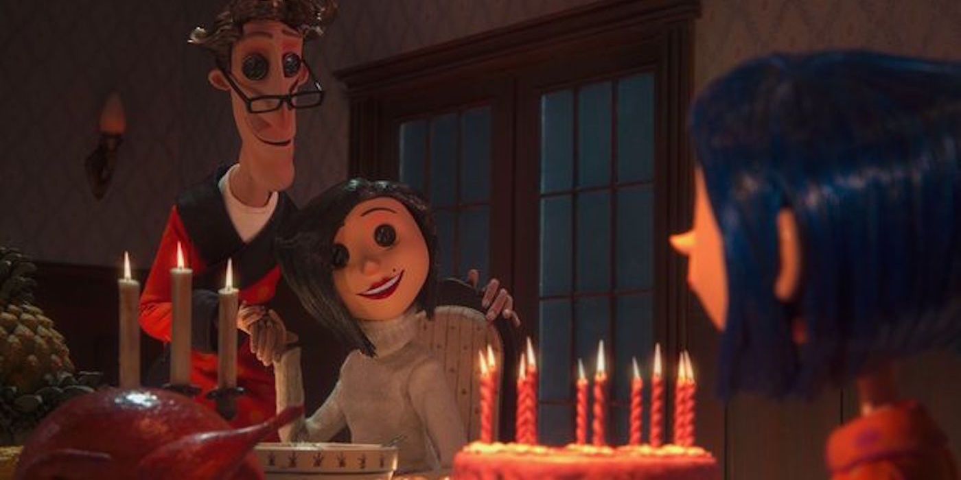 An image of Coraline's other mother and father sitting at the dinner table in Coraline