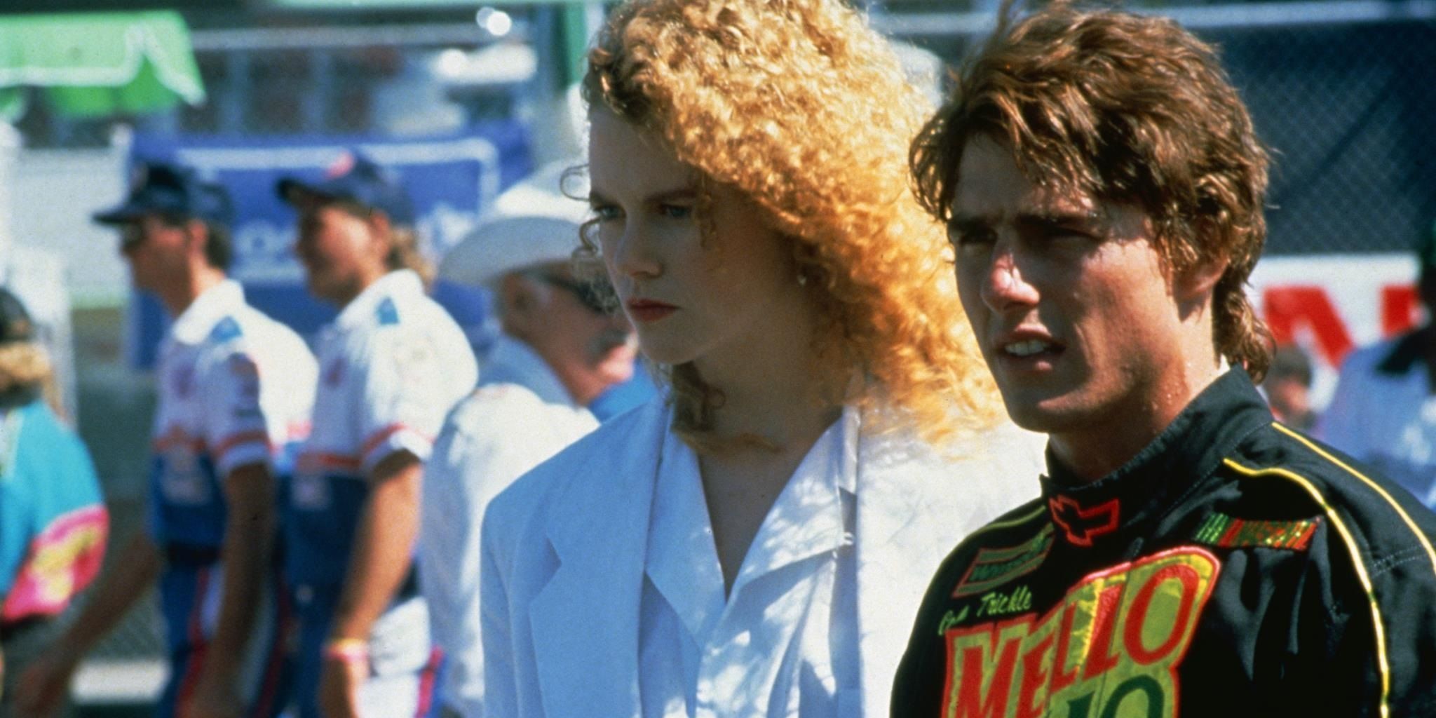 Tom Cruise and Nicole Kidman looking out at the raceway in Days of Thunder