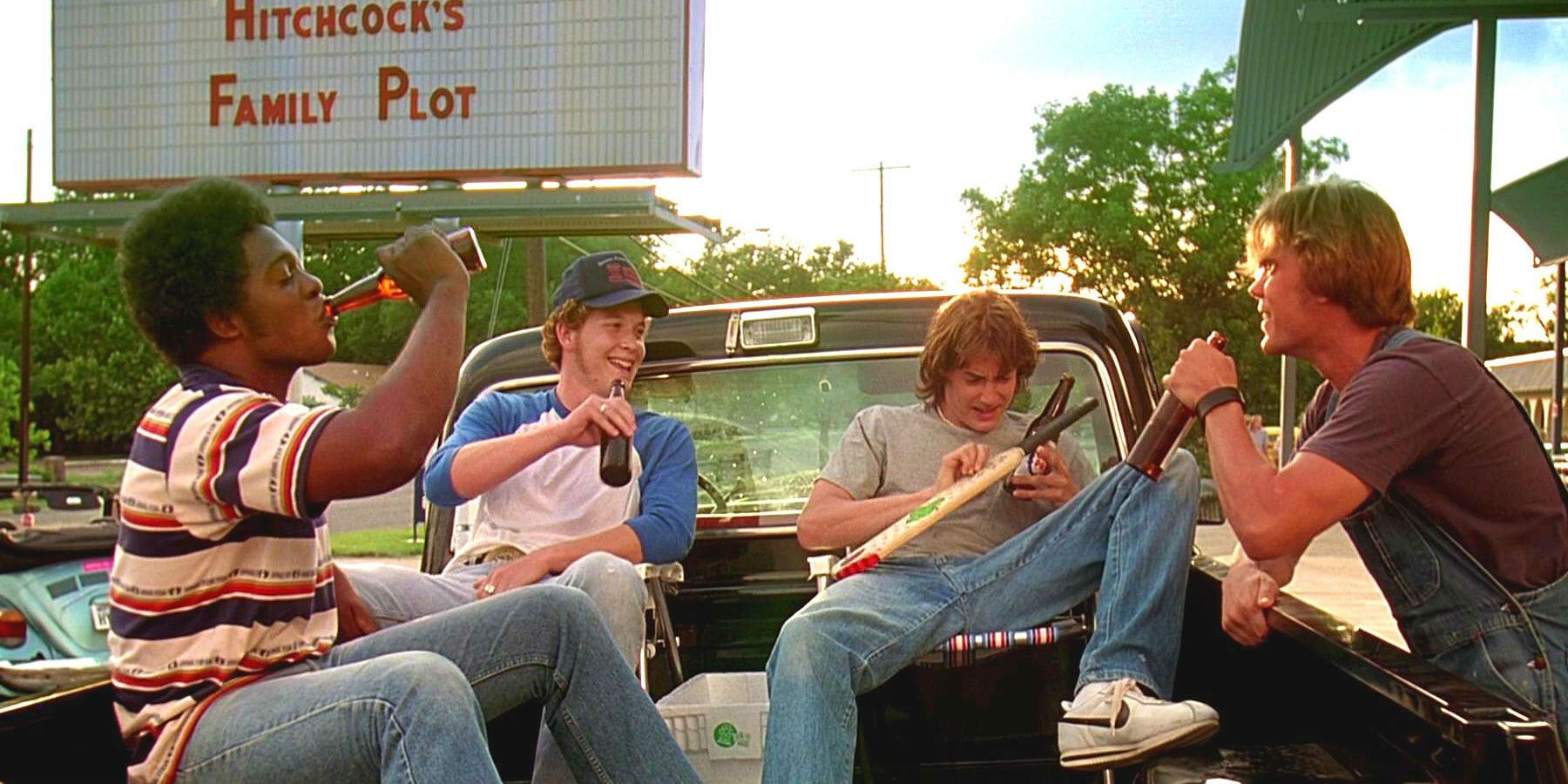 The cast of Dazed and Confused sitting in the back of a truck