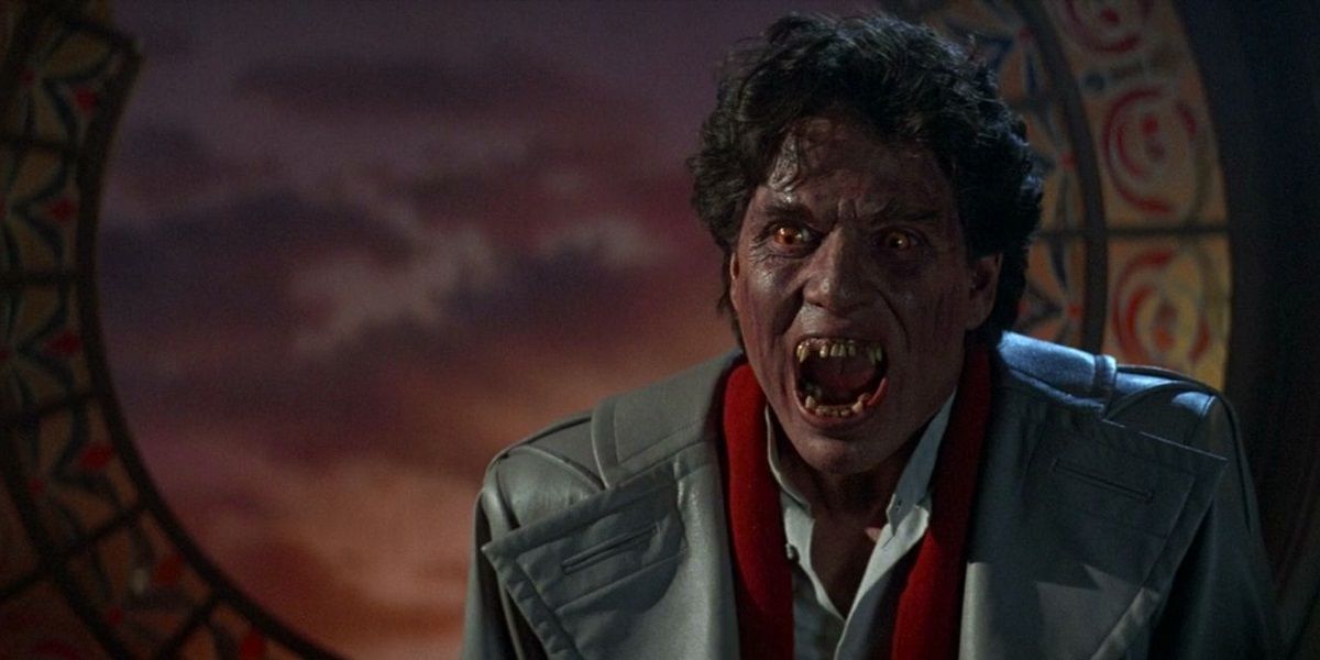 Chris Sarandon scowling as a vampire in a still from Fright Night