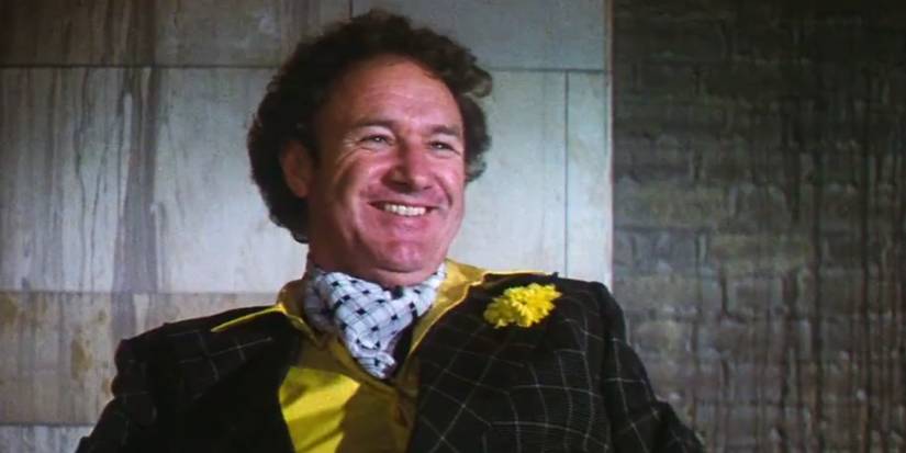 Close-up shot of Gene Hackman as Lex Luthor laughing in Superman