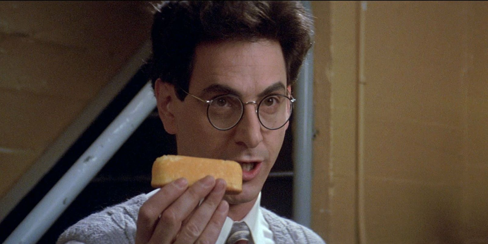 Harold Ramis with a twinkie in Ghostbusters