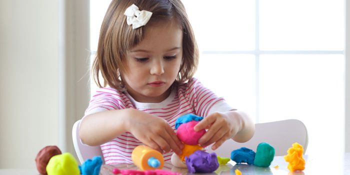 girl with play doh