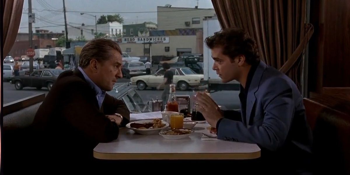 Robert De Niro and Ray Liotta sit in a diner in Goodfellas