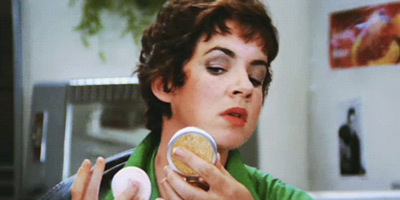 Stockard Channing as Rizzo, covering up hickeys, in Grease