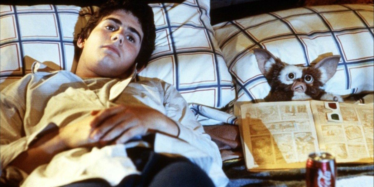 Billy and Gizmo lying in bed from Gremlins 
