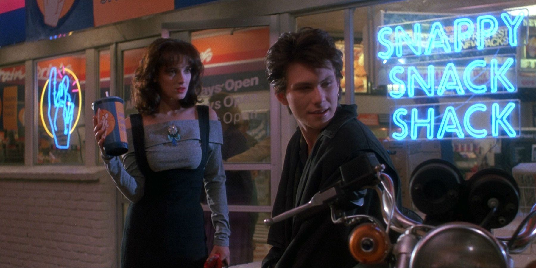 Winona Ryder and Christian Slater outside restaurant in Heathers