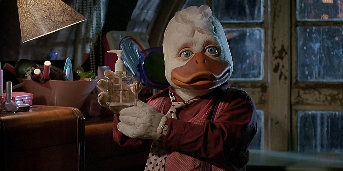 Howard holding up a soap bottle in Howard The Duck