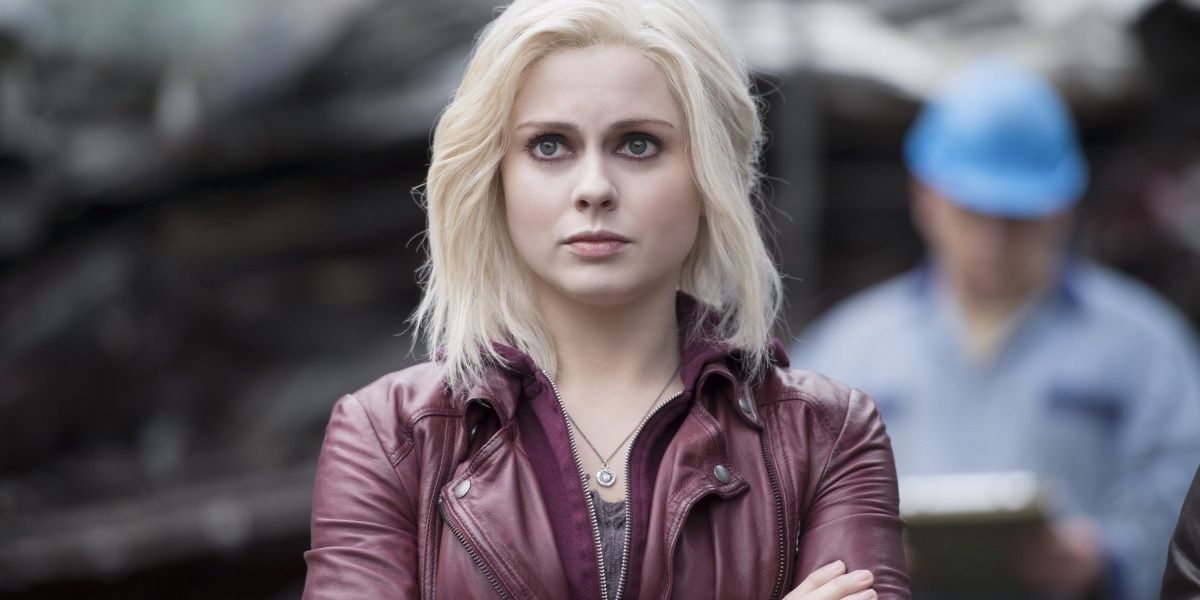 Olivia standing with her arms crossed and looking at something in iZombie