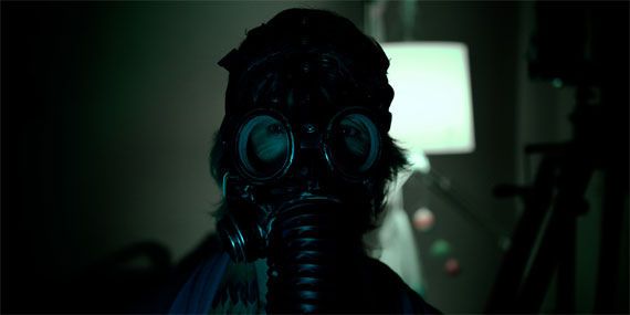 Creepy old woman in a mask in a scene from Insidious